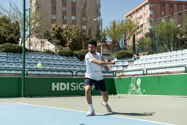 tennis player forehand hard court